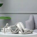 Femme Sculptura - Graceful ceramic woman ornament in a fluid silhouette for modern luxury home decor.