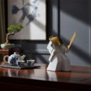 Wondering Samurai Figurine - Serene ceramic swordsman sculpture for sophisticated home decor.